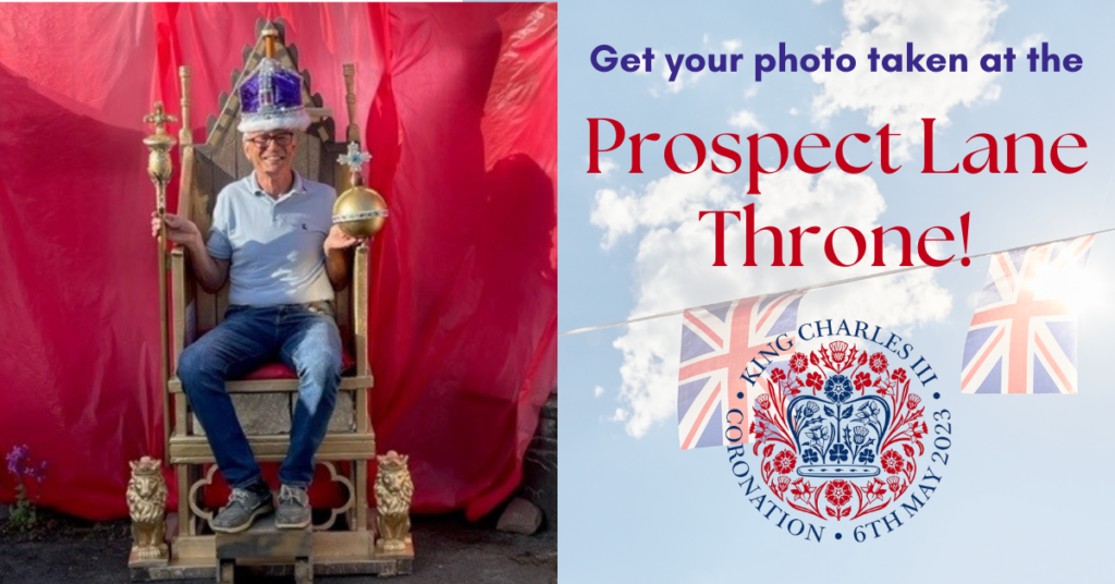 Get your photo taken at the Prospect Lane Throne! - King Charles III coronation graphic - A man wearing a blue polo shirt and jeans sits in a golden throne. He has a purple crown on his head, and carries a royal orb in one hand and a royal sceptre in the other. He smiles broadly. The backdrop is a red cloth, in front of a house.