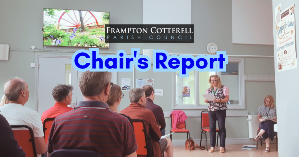 Frampton Cotterell Parish Council Chair's Report. Text over a photograph of the Brockeridge Centre community hall, the chair stands in front of a seated audience delivering her report.