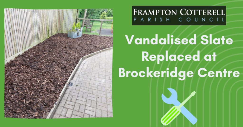 Frampton Cotterell Parish Council. Vandalised Slate Replaced at Brockeridge Centre. Photograph of planter border now filled with bark chips.